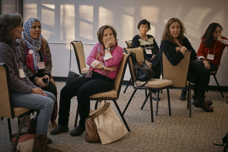 Muslim and Jewish women listen to a speaker as they gather at an interfaith workshop on the Israeli-Palestinian conflict at Rutgers University on Sunday, Nov. 19, 2023, in New Brunswick, N.J. The latest violence, triggered by the Oct. 7 Hamas attack on Israel, is prompting some to question such dialogue, its role, impact -- or how to even have it-- while steeling the resolve of others to connect and wrestle together with the challenges. (AP Photo/Andres Kudacki)