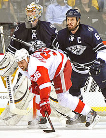 Holmstrom pays the price for hanging around the crease, rarely losing his cool or his concentration