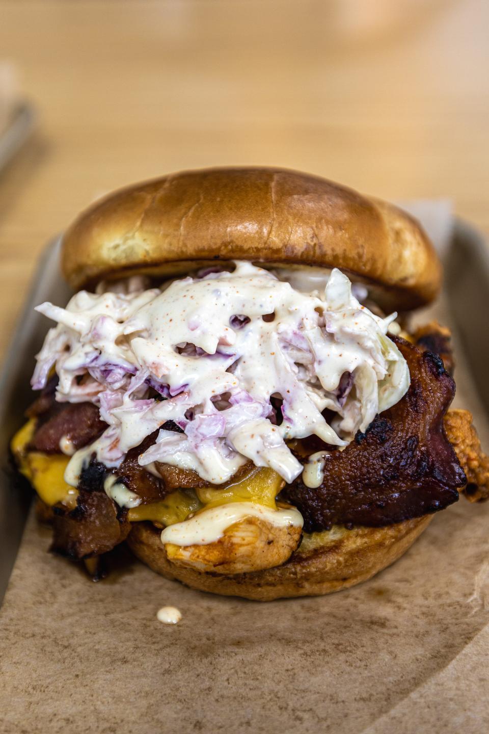 The Eatery’s chipotle chicken sandwich features smoky chipotle chicken, cheddar cheese, maple bacon, Alabama white sauce and served on a brioche bun.