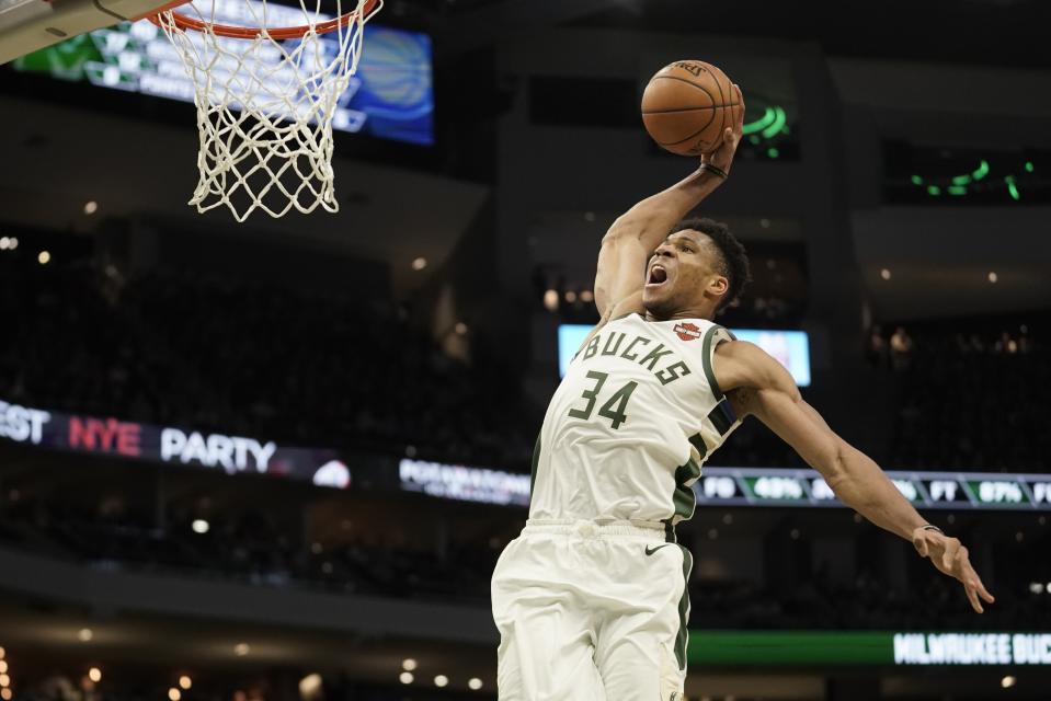 Milwaukee Bucks' Giannis Antetokounmpo dunks during the second half of an NBA basketball game against the Indiana Pacers Sunday, Dec. 22, 2019, in Milwaukee. The Bucks won 117-89. (AP Photo/Morry Gash)