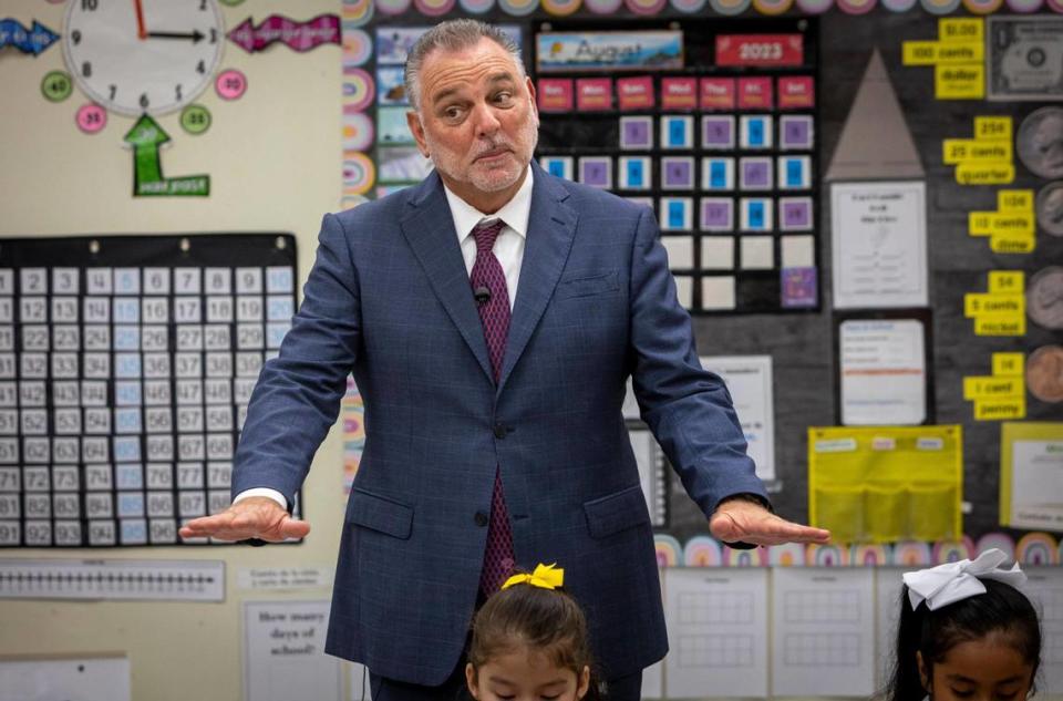 North Lauderdale, August 21, 2023 - Broward School Superintendent Peter Licata, center, reacts as students color their assignments at a first grade classroom in Broadview Elementary School on the first day of school in Broward County.