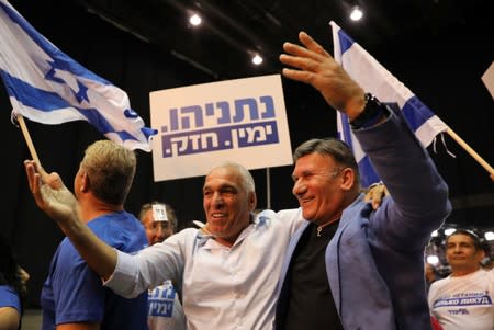 Supporters of Israeli Prime Minister Benjamin Netanyahu's Likud party react to exit polls in Israel's parliamentary election at the party headquarters in Tel Aviv