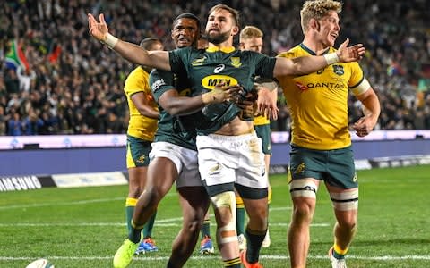  Cobus Reinach celebrates scoring a try - Credit: AFP