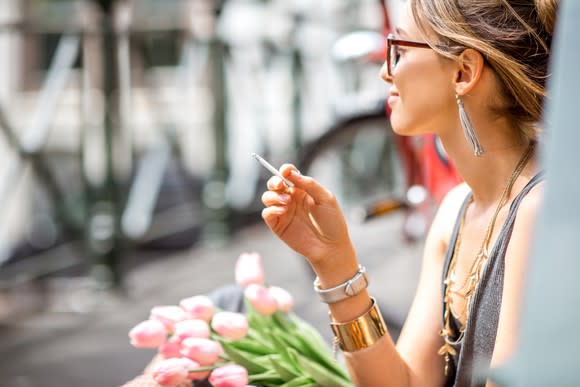 Young woman smoking a cigarette.