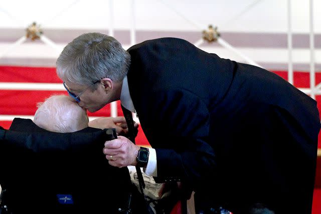 <p> ANDREW CABALLERO-REYNOLDS/AFP via Getty Images</p> James "Chip" Carter kisses the head of his father, former US President Jimmy Carter, during a tribute service for former US First Lady Rosalynn Carter