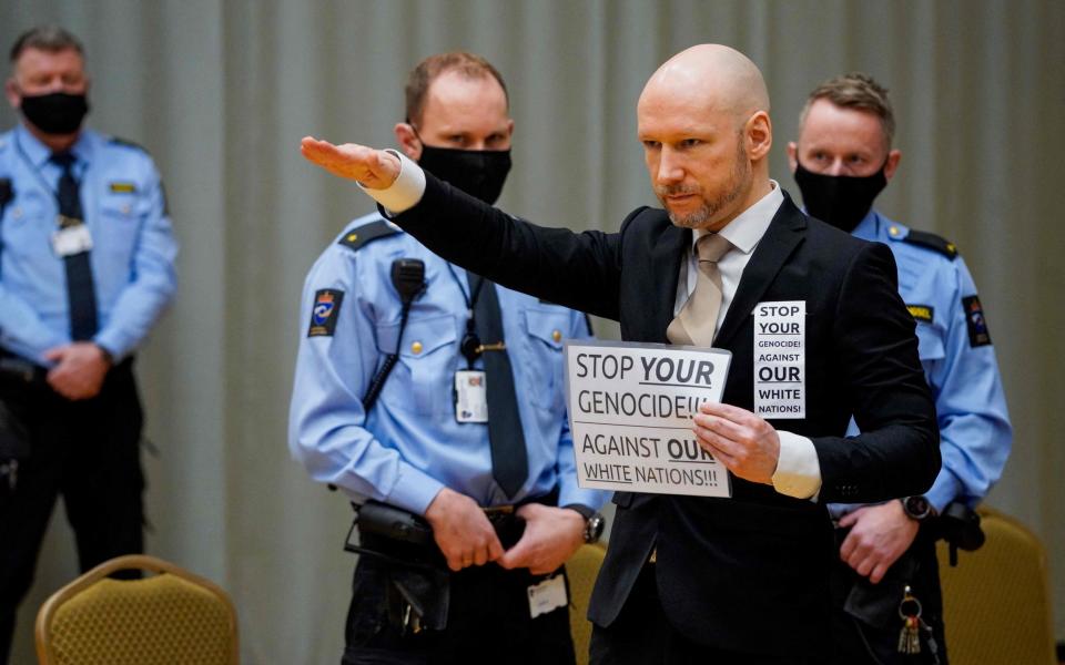 Anders Behring Breivik raises his arm to make a Nazi salute - /Ole Berg-Rusten/NTB/AFP via Getty Images