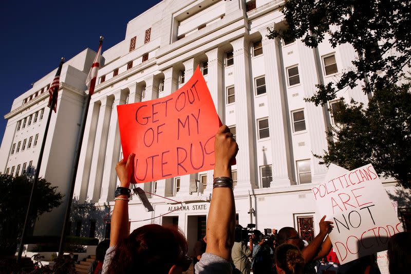 FILE PHOTO: Pro-choice supporters protest in front of the Alabama State House as Alabama state Senate votes on the strictest anti-abortion bill in the United States at the Alabama Legislature in Montgomery