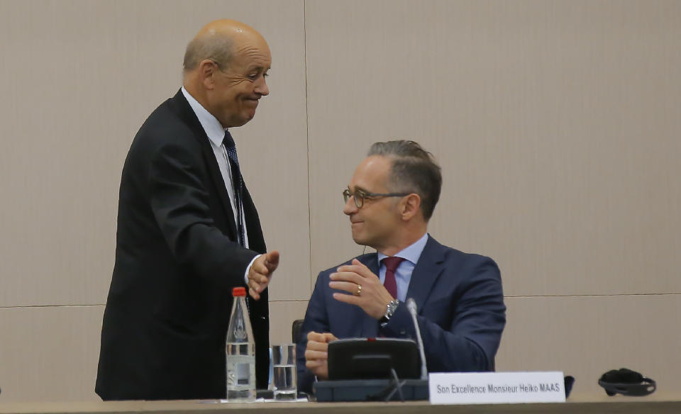 French Foreign Minister Jean-Yves Le Drian left, and German Foreign Minister Heiko Maas attend the opening session of the French ambassadors to European countries in Paris, Monday, Aug. 31, 2020. (AP Photo/Michel Euler)