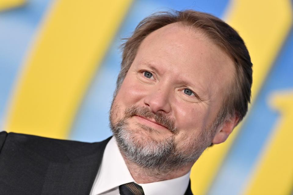 Rian Johnson in a suit and tie