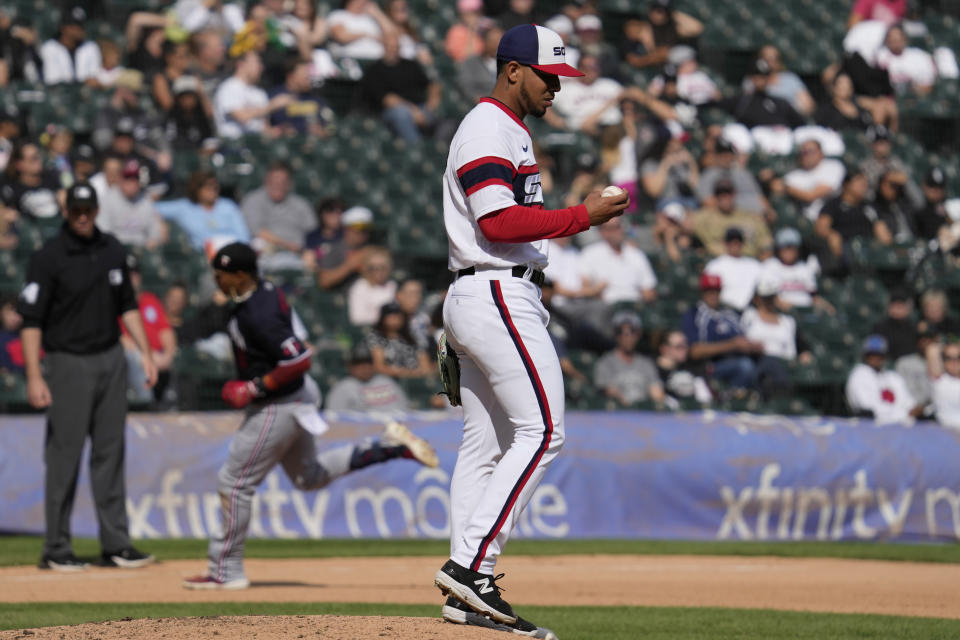 Chicago White Sox relief pitcher Luis Patino looks at a ball after Minnesota Twins' Jorge Polanco hit a solo home run during the eighth inning of a baseball game in Chicago, Sunday, Sept. 17, 2023. (AP Photo/Nam Y. Huh)