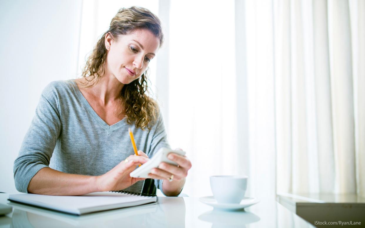 woman using a calculator