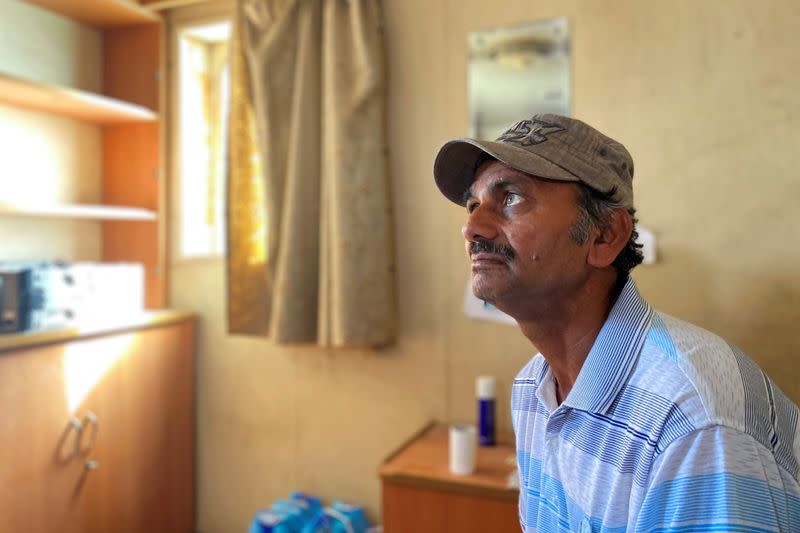 A crew member of an oil tanker named MT Iba is seen in Umm Al Quwain