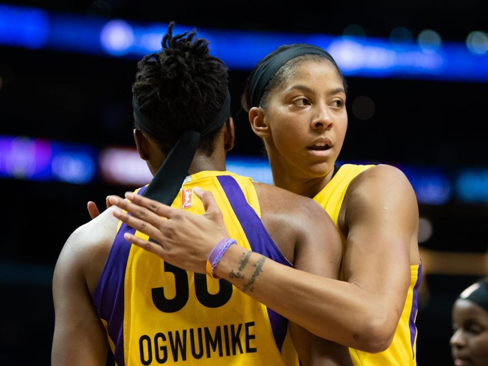 Candace Parker (right) pats Nneka Ogwumike on the back.