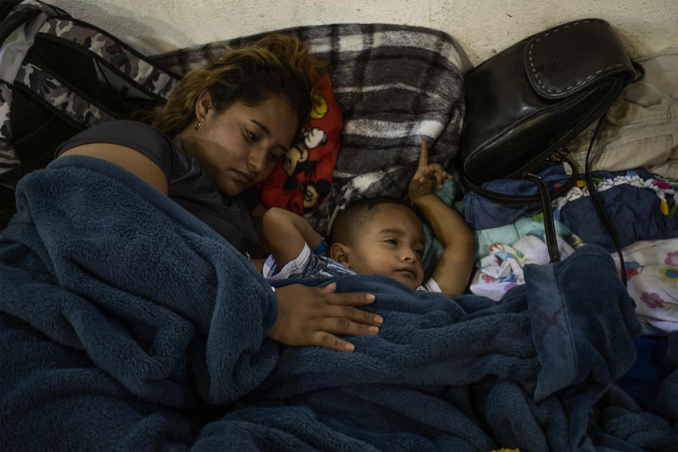 Xenia (19) and her son Kevin (4) rest at Tijuana’s Barretal shelter, December 2, 2018. (Photo: Fabio Bucciarelli for Yahoo News)