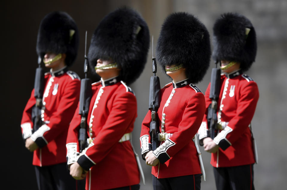 Members of the Welsh Guards perform in a ceremony to mark the official birthday of Britain's Queen Elizabeth II, at Windsor Castle in Windsor, England, Saturday June 13, 2020. Queen Elizabeth II’s birthday is being marked with a smaller ceremony than usual this year, as the annual Trooping the Color parade is canceled amid the coronavirus pandemic. The Queen celebrates her 94th birthday this year. (Toby Melville/Pool via AP)