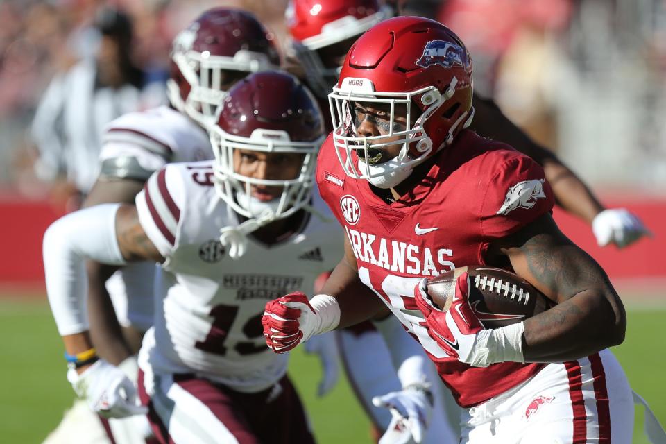 Nov 6, 2021; Fayetteville, Arkansas, USA; Arkansas Razorbacks wide receiver Treylon Burks (16) runs after a catch during the first quarter against the Mississippi State Bulldogs at Donald W. Reynolds Razorback Stadium. Mandatory Credit: Nelson Chenault-USA TODAY Sports