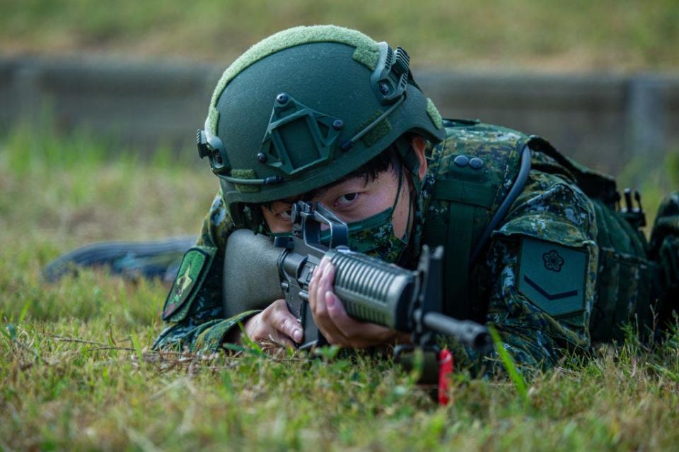 A Taiwanese soldier aims with a rifle during the Han Kuang military exercise, which simulates China's People's Liberation Army (PLA) invading the island on July 27, 2022 in New Taipei City, Taiwan