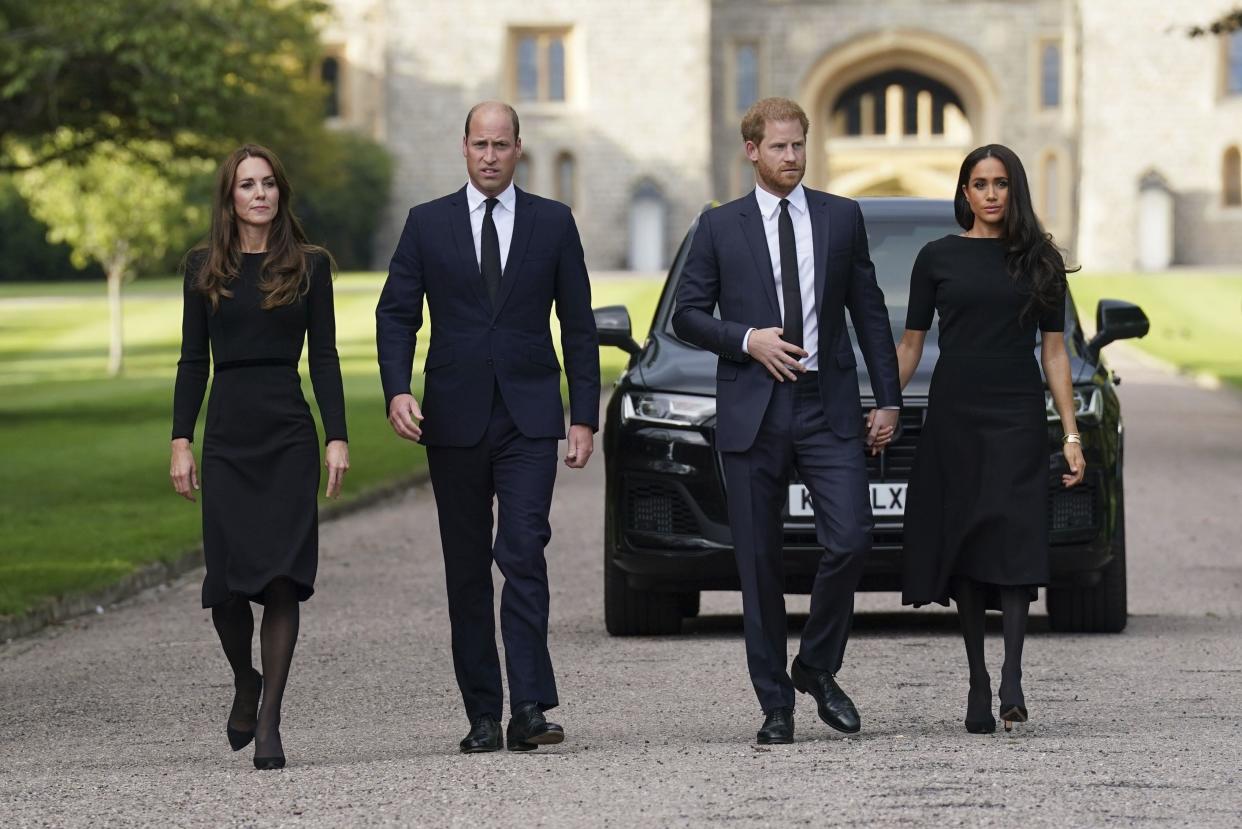 From left, Kate, the Princess of Wales, Prince William, Prince of Wales, Prince Harry and Meghan, Duchess of Sussex walk to meet members of the public at Windsor Castle, following the death of Queen Elizabeth II on Thursday, in Windsor, England, Saturday, Sept. 10, 2022. 