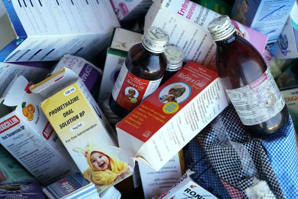 A photograph shows collected cough syrups in Banjul. Indian authorities are investigating cough syrups made by a local pharmaceutical company after the World Health Organisation said they could be responsible for the deaths of 69 children in The Gambia (AFP via Getty Images)