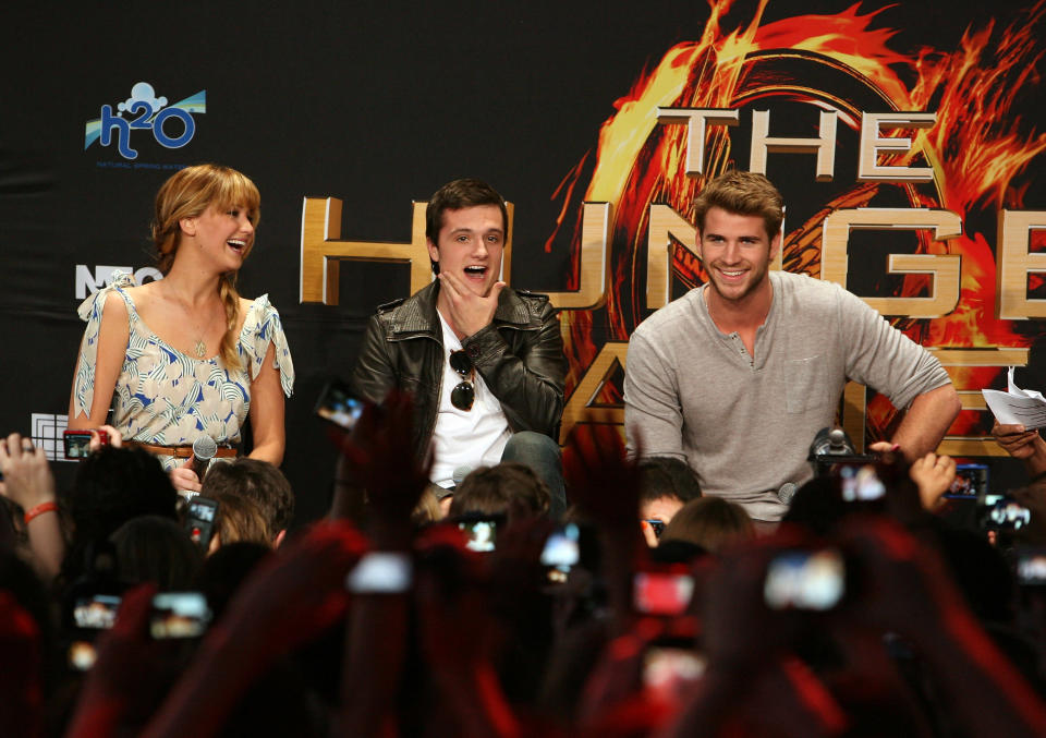 Actors Jennifer Lawrence, Josh Hutcherson and Liam Hemsworth attend The Hunger Games U.S. Mall Tour Kick-Off at Westfield Century City on March 3, 2012 in Los Angeles, California. (Photo by Jesse Grant/Getty Images for Lionsgate)