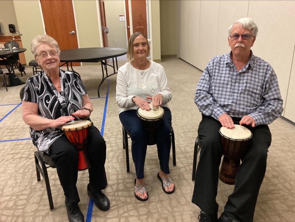 Drumming is one of many artistic activities at the memory cafe at First United Methodist Church of Lakeland. L-R are Nancy Lane, Kathy Leahy and Dave Leahy. Lane is Kathy Leahy’s sister, who was visiting the Leahys in Lakeland.