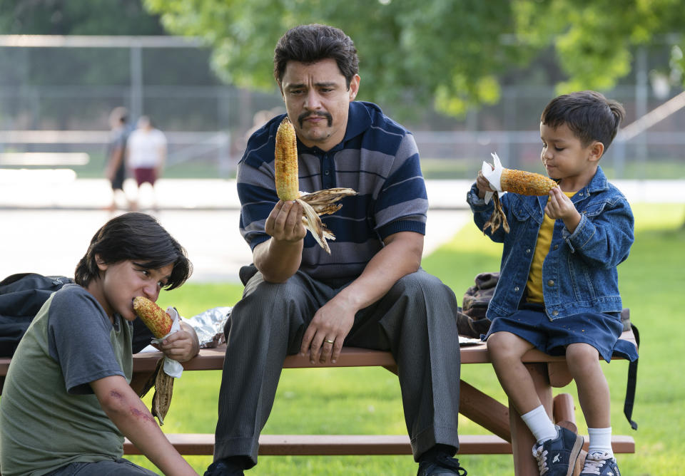 This image released by Searchlight Pictures shows, from left, Hunter Jones, Jesse Garcia and Brice Gonzalez in a scene from "Flamin' Hot, a tale of how a Mexican American janitor came up with the idea for Flamin’ Hot Cheetos. (Emily Aragones/Searchlight Pictures via AP)