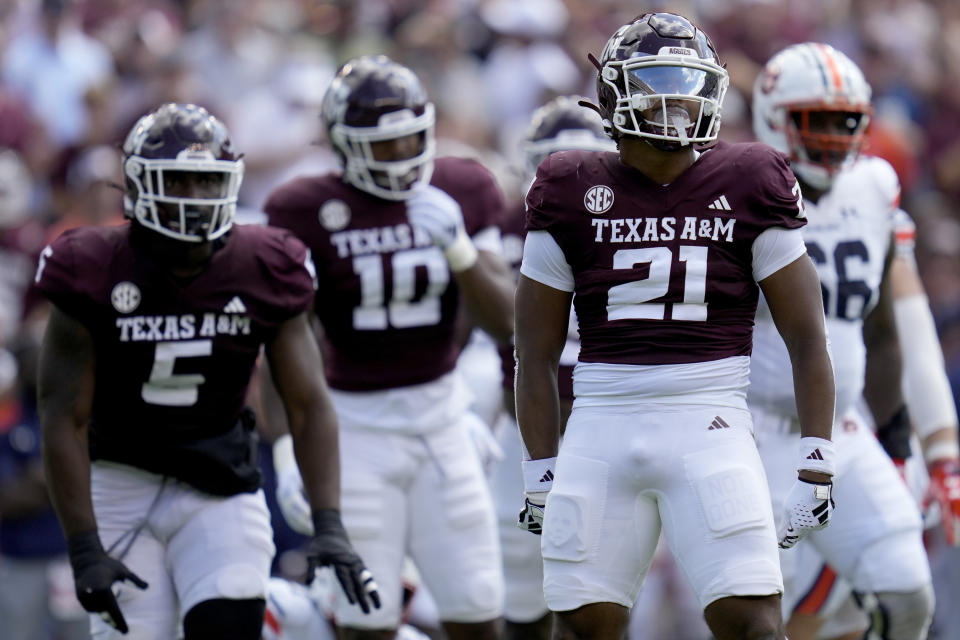 Texas A&M linebacker Taurean York (21) reacts after sacking Auburn quarterback Payton Thorne (1) during the first quarter of an NCAA college football game Saturday, Sept. 23, 2023, in College Station, Texas. (AP Photo/Sam Craft)