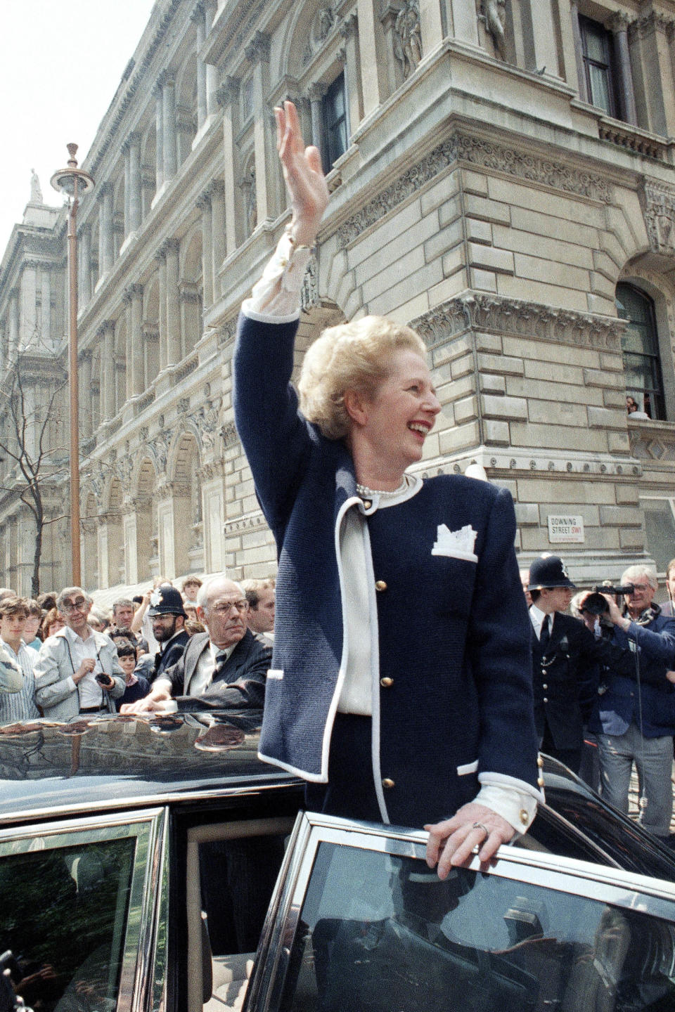 Prime Minister Margaret Thatcher waves to the crowd after she was re-elected in June 1987.  (Dave Caulkin / AP file)