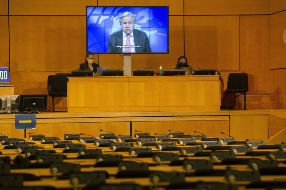 A screen shows U.N. Secretary-General Antonio Guterres making his statement by video, during the opening of the 46th session of the Human Rights Council, at the European headquarters of the United Nations in Geneva, Switzerland, Monday Feb. 22, 2021. (Salvatore Di Nolfi/Keystone via AP)