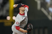 Washington Nationals starting pitcher MacKenzie Gore throws to the Texas Rangers in the first inning of a baseball game in Arlington, Texas, Tuesday, April 30, 2024. (AP Photo/Tony Gutierrez)