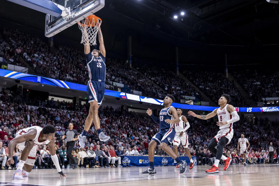 Gonzaga forward Anton Watson (22) gets loose for a dunk against Alabama during the second half of an NCAA college basketball game, Saturday, Dec. 17, 2022, in Birmingham, Ala. (AP Photo/Vasha Hunt)