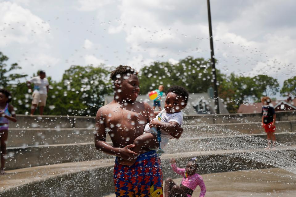 Children cool off in the spray area at Hull Park on Tuesday June 14, 2022 as the heat index climbed over 100 for the second straight day.