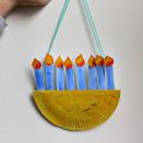 <p>Kids can make their own wallhanging menorahs using an ordinary paper plate. Combine with a free printable, paint, and ribbon for hanging — and voila!</p><p><a href="https://nurturestore.co.uk/easy-paper-plate-menorah-craft-with-printable-template" rel="nofollow noopener" target="_blank" data-ylk="slk:Get the tutorial at NurtureStore;elm:context_link;itc:0;sec:content-canvas" class="link "><em>Get the tutorial at NurtureStore</em></a></p>