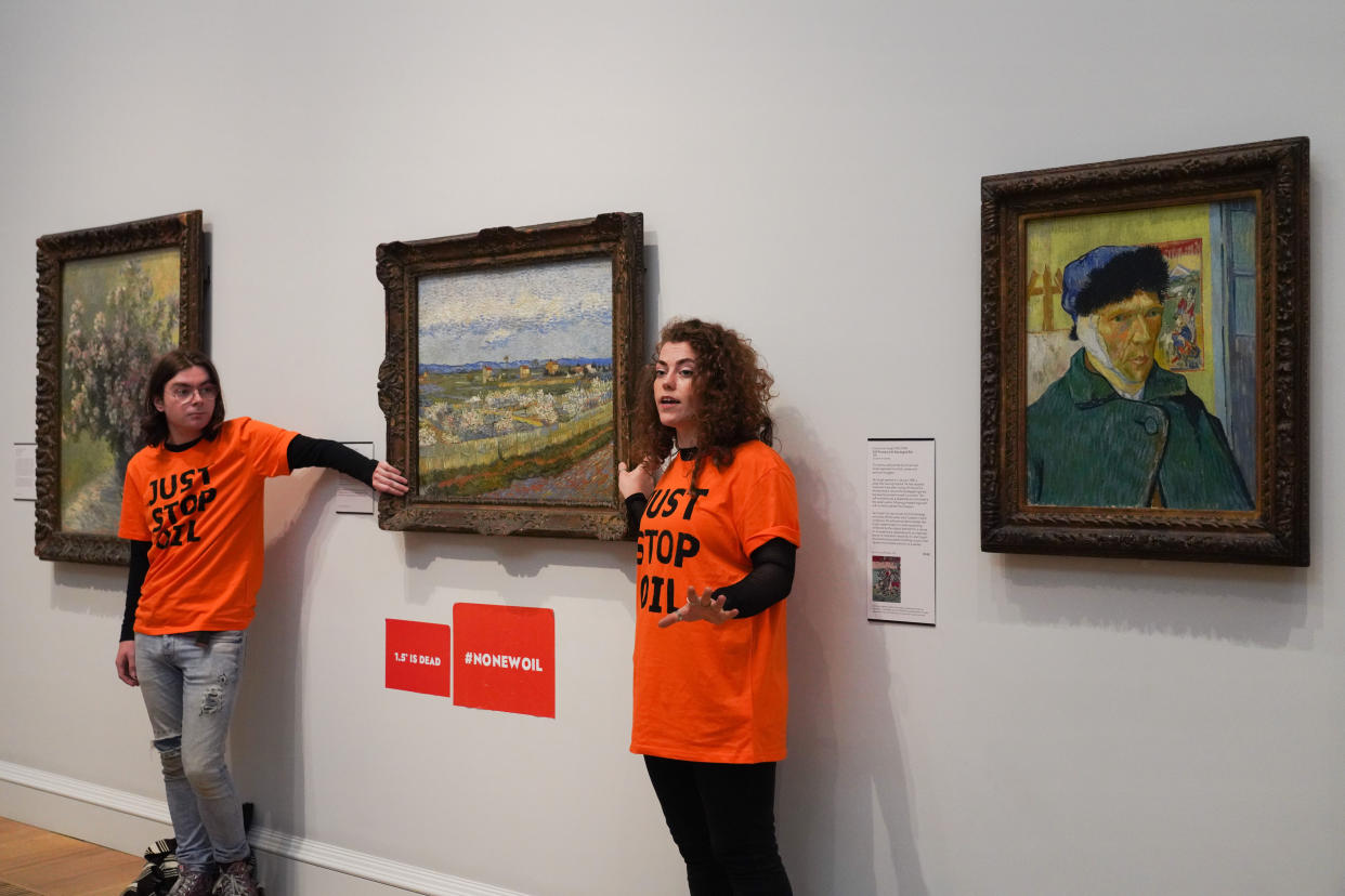 Just Stop Oil climate activists glue themselves to a Van Gogh painting at the Courtauld Gallery in London. 