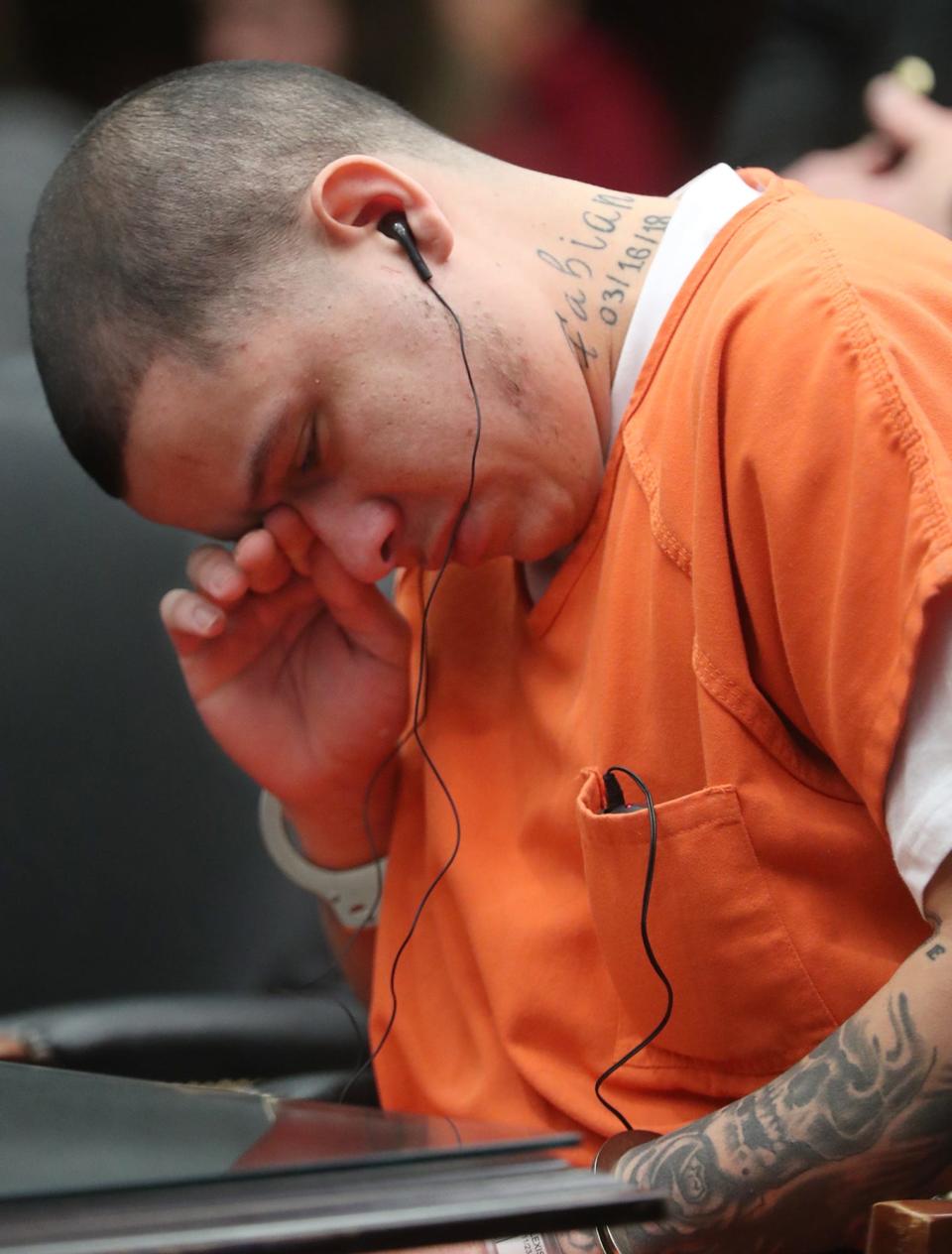 Jose Castro wipes away a tear Tuesday as he pleads guilty to shooting his girlfriend and kidnapping their 4-year-old son in Summit County Common Pleas Court.