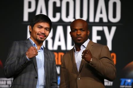 Jan 21, 2016; New York, NY, USA; Manny Pacquiao and Tim Bradley Jr. pose for a photo during press conference at Madison Square Garden to announce the upcoming boxing fight on April 9, 2016 in Las Vegas. Mandatory Credit: Noah K. Murray-USA TODAY Sports