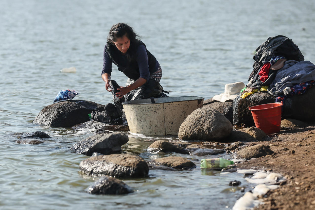 Women wash clothes on the dry banks of the Villa Victoria dam, which is at 30.5 percent of its capacity on February 28, 2024 in Villa Victoria, Mexico.  / Credit: / Getty Images