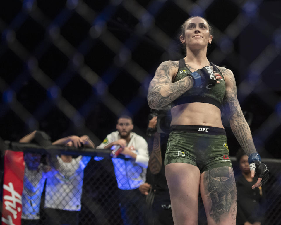 Megan Anderson celebrates her win over Cat Zingano in a featherweight mixed martial arts bout at UFC 232, Saturday, Dec. 29, 2018, in Inglewood, Calif. (AP Photo/Kyusung Gong)