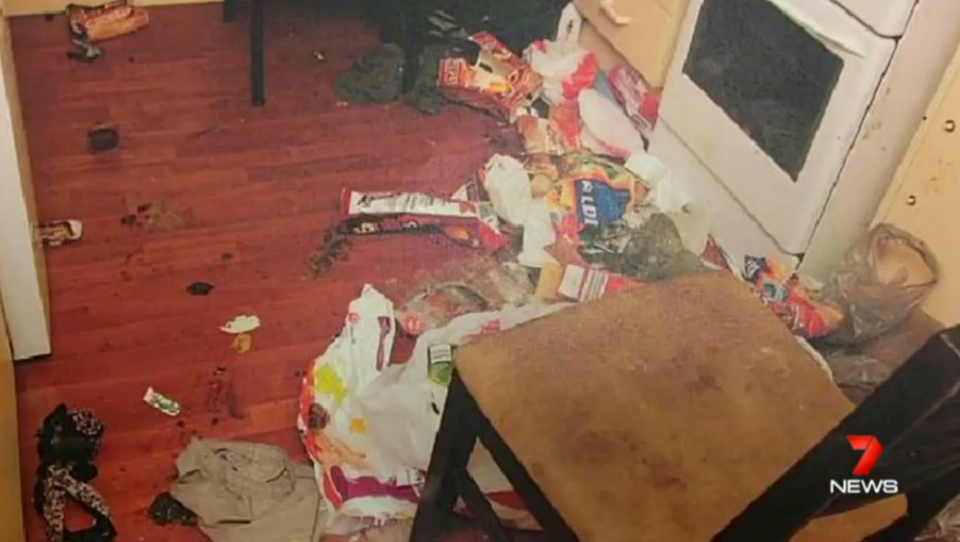 Inside the house of horrors, the pantry is a dirty floor covered in rubbish and rotting food. Photo: 7 News