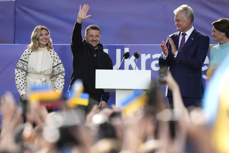 Ukraine's President Volodymyr Zelenskyy, second left, and Lithuania's President Gitanas Nauseda, second right, address the public during an event on the sidelines of a NATO summit in Vilnius, Lithuania, Tuesday, July 11, 2023. Ukrainian President Volodymyr Zelenskyy on Tuesday blasted as "absurd" the absence of a timetable for his country's membership in NATO, injecting harsh criticism into a gathering of the alliance's leaders that was intended to showcase solidarity in the face of Russian aggression. (AP Photo/Pavel Golovkin)