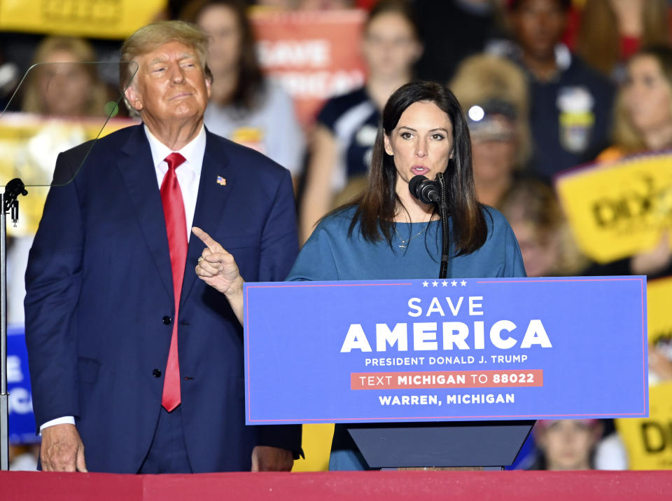 FILE - Former President Donald Trump, left, listens to Michigan Republican gubernatorial candidate Tudor Dixon, during a rally at the Macomb Community College Sports & Expo Center in Warren, Mich., Oct. 1, 2022. Dixon lost to Democrat incumbent Gov. Gretchen Whitmer. (Todd McInturf/Detroit News via AP, File)