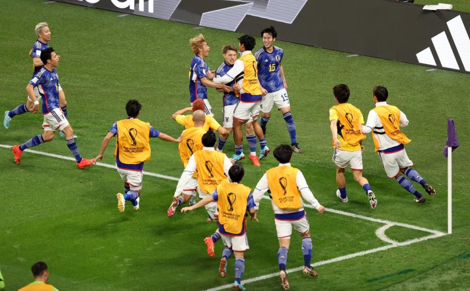 Japan players celebrate after Ritsu Doan scores (REUTERS)