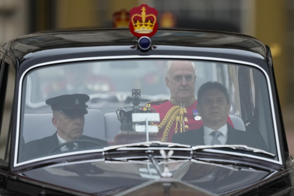 A car carrying the Queen's crown leaves Buckingham Palace for the State Opening of Parliament, at the Palace of Westminster in London, Tuesday, May 10, 2022. Buckingham Palace said Queen Elizabeth II will not attend the opening of Parliament on Tuesday amid ongoing mobility issues. (AP Photo/Frank Augstein)