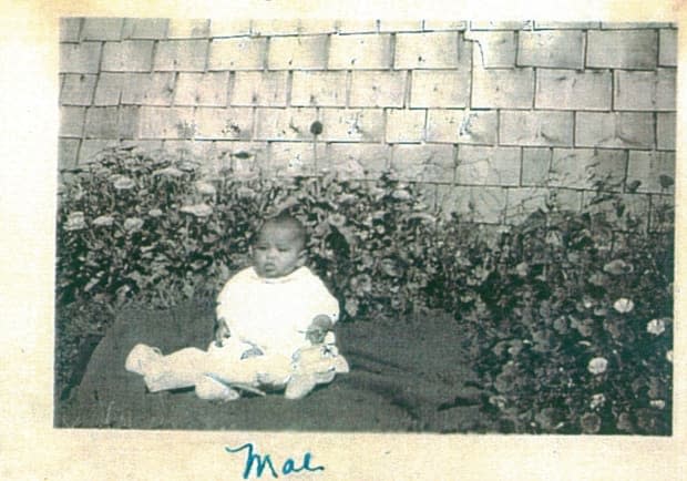 Deborah Dobbins' mother, Mae, sits in front of the homestead house where she grew up in Wildwood, Alberta, west of Edmonton. Wildwood was the province's first established Black community.