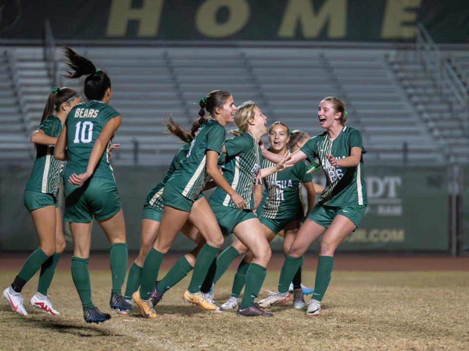 The Basha girls soccer team celebrates a goal against Desert Vista at Basha High School in Chandler, Ariz. on Dec. 13, 2023.