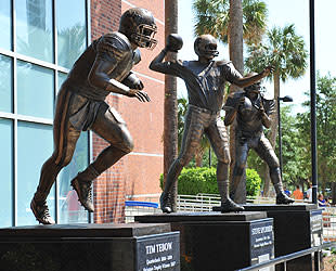 The statue of Spurrier outside Florida's stadium is between Tim Tebow's and Danny Wuerffel's. (Getty Images)