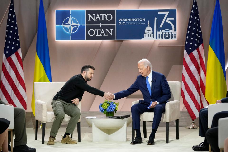 President Joe Biden, right, shakes the hand of Ukraine's President Volodymyr Zelenskyy during a meeting on the sidelines of the NATO Summit in Washington, Thursday, July 11, 2024 (AP)