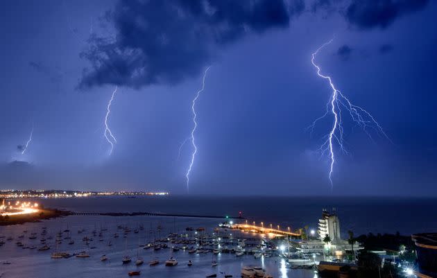 Lightning bolts strike near the Uruguayan Yacht Club during a thunderstorm in Montevideo on Saturday.  (Photo: MARIANA SUAREZ / Getty Images)