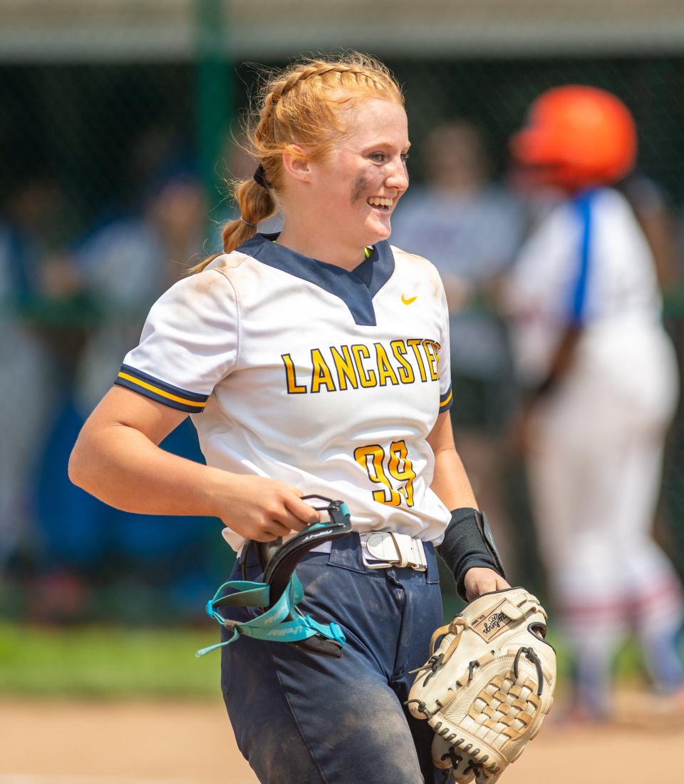 Lancaster pitcher Reese Poston is all smiles following the Golden Gales’ 5-1 win over Olentangy Orange in a Division I district final May 21 at Pickerington Central. Poston went the distance in the circle.