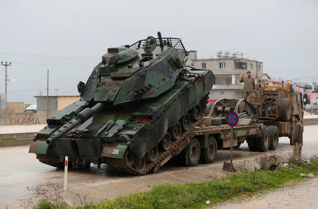 A Turkish military tank arrives at an army base in the border town of Reyhanli near the Turkish-Syrian border in Hatay province, Turkey January 17, 2018. REUTERS/Osman Orsal